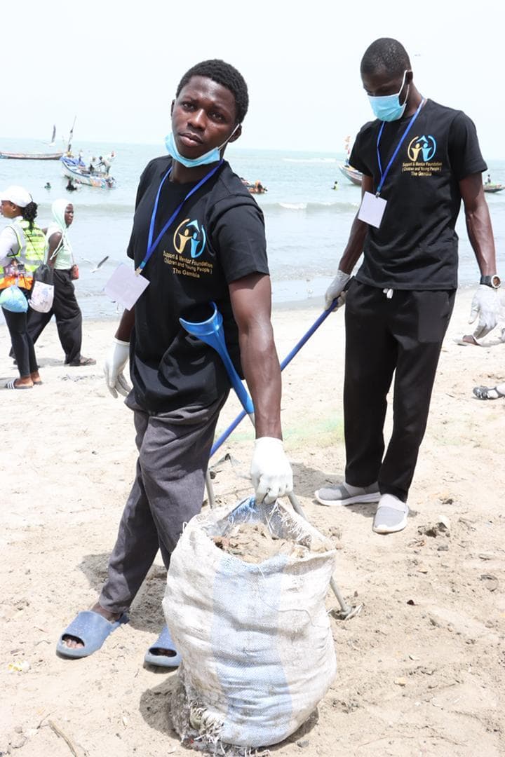 A young SMF volunteer at a community event in The Gambia